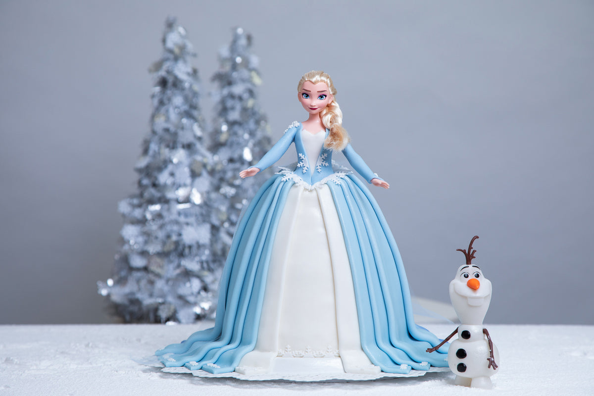 dollcake blue dress Worth every minute! Every layer of this beautiful blue doll cake was individually made and carefully placed by hand to create her flowing fondant gown. From the tiniest details to the final